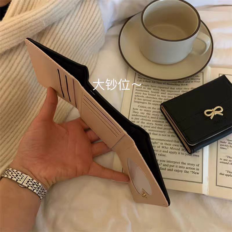 Luxury Leather Wallet with a Golden Bow Accent