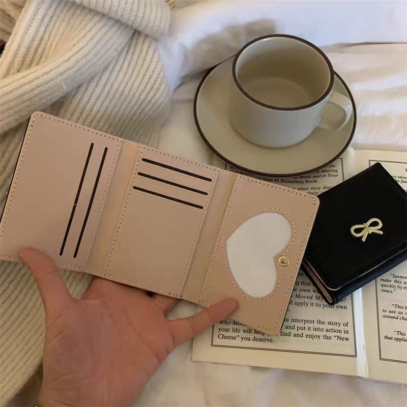 Luxury Leather Wallet with a Golden Bow Accent