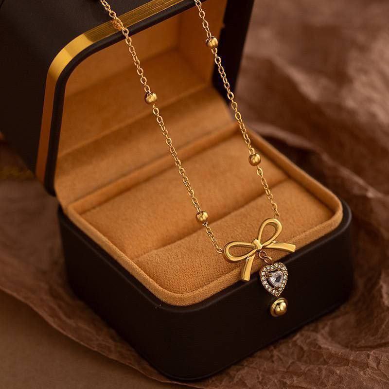 Elegant Bow Necklace with Crystal Heart Pendant